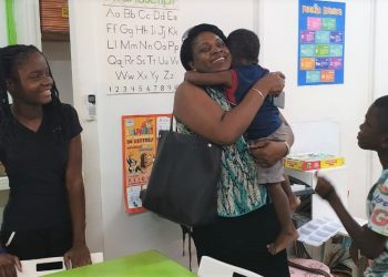 Prime Minister Romeo Marlin spends time  with children of the Super Star Sunday Program