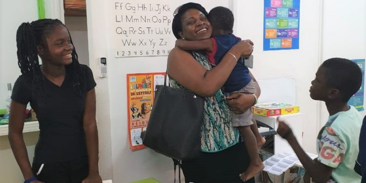 Prime Minister Romeo Marlin spends time  with children of the Super Star Sunday Program