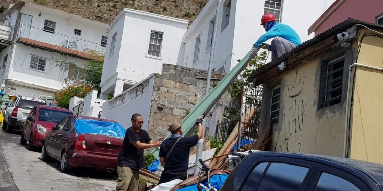 Chinese contractors at Maho volunteer and repaired 3 homes before leaving country