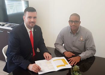 Minister Johnson receives Maximum  Price List 2019 Hurricane items Booklet