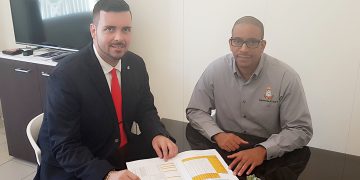 Minister Johnson receives Maximum  Price List 2019 Hurricane items Booklet