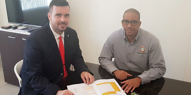 Minister Johnson receives Maximum  Price List 2019 Hurricane items Booklet