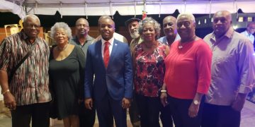 Minister Doran hosts Justice event for workers, past and present. Says “It is the fingers in unity that make the hand”