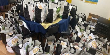 Rotarians Deliver Holiday Cheer To Those in Need