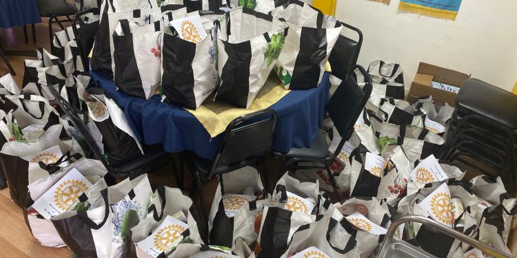 Rotarians Deliver Holiday Cheer To Those in Need