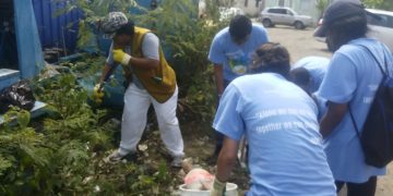 Tzu Chi, AUC students clean Pond Island