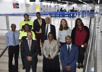 Minister Richardson receives presentation on ICT-system used by Immigration at the airport