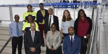 Minister Richardson receives presentation on ICT-system used by Immigration at the airport