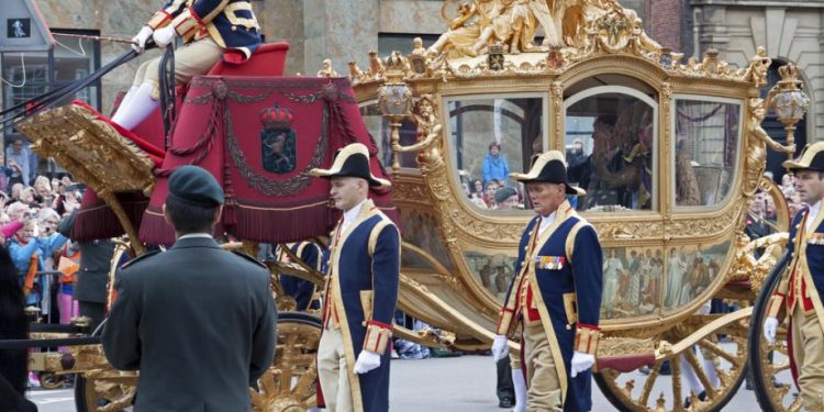 King undecided on using carriage with controversial colonial painting