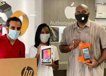 MP Omar Ottley along with others donates 63 electronic devices to allow students in need to participate in online learning.