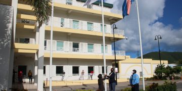 Prime Minister Silveria E. Jacobs raises the SDG flag