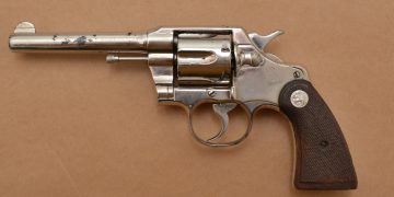 A male suspect was arrested for having a firearm in his car.