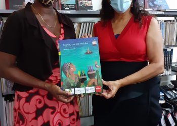 Morales hands over 2 copies of the BNK Children year book 2020 to PJL