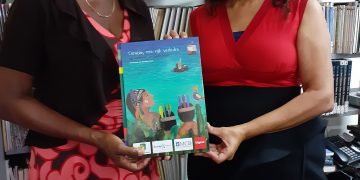 Morales hands over 2 copies of the BNK Children year book 2020 to PJL