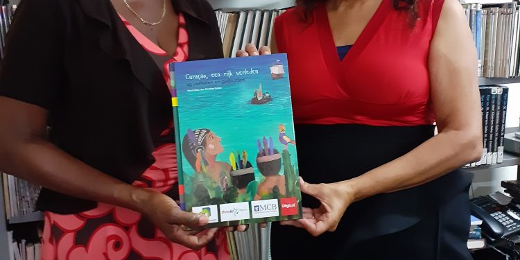 Morales hands over 2 copies of the BNK Children year book 2020 to PJL