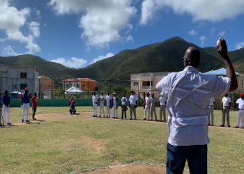 Minister Samuel delivers the game two opening pitch