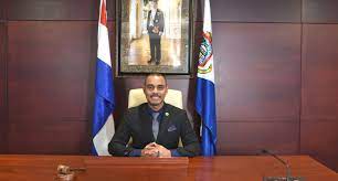 Chairman of Parliament poses several questions to Minister of Justice, during draft national ordinance establishing the budget of Sint Maarten
