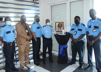Government Security Dept. Staff Sign Condolence Memorial Book for the late Vivian Philips